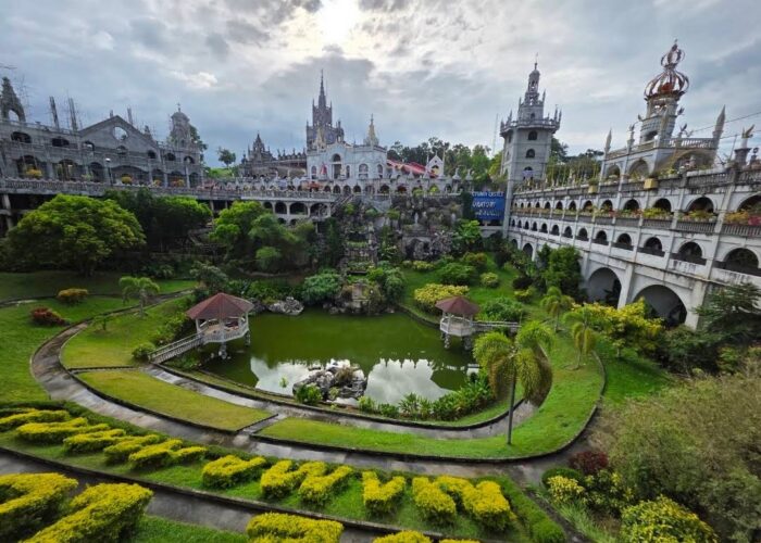 The castle-like church, gardens, and pond at Simala Shrine in Sibonga, Cebu.