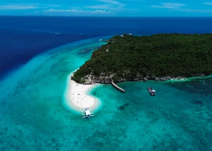 Aerial view of Sumilon Island’s white sandbar and clear turquoise water during a Cebu one-day tour package.