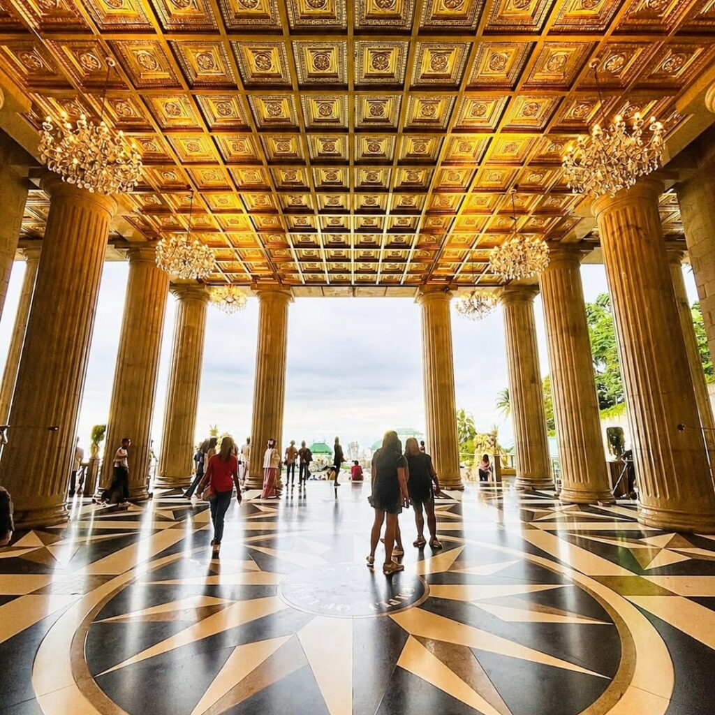 Visitors exploring the grand hall of Temple of Leah during a Cebu Mountain Tour.